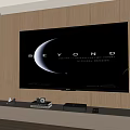 Large TV Mounted On Wooden Wall Displaying Beyond With Green Plant And Table Lamp