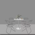 Modern Dining Table and Chair Set with White Round Top Transparent Seats and Metal Frame