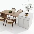 Dining Table Set With Four Wooden Chairs Side Cabinet Fruit Bowl And Decorative Plant