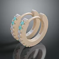 Gold Tone Hoop Earrings Adorned With Turquoise Stones And Delicate Details