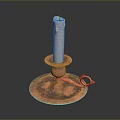 White Candle Placed On Copper Candlestick Holder With Base And Handle