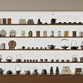 Traditional Tea Collection Display With Various Teapots Cups And Canisters On Shelves