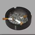 Decorative Ornament Set Including Black Ashtray With Cigarette Butts And Ash