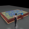 Interactive Sand Table with Blue Building Models Control Panel Screen and Person Standing 3d model