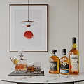 Wine Bottles And Glasses Arranged With Hanging Lamp And Red Sun Wall Art