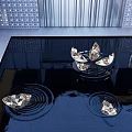Metallic Sculptures in Water Pool with Ripples and Reflective Surface