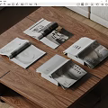Open Magazines on Wooden Coffee Table with Pages Showing Images and Text