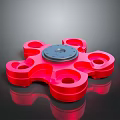 Red Multi Blade Weapon With Central Disc And Fidget Spinner Like Design