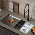 Stainless Steel Kitchen Sink with Modern Faucet and Fresh Fruits on Countertop with Tile Backsplash