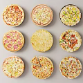 Assorted Pizza Varieties With Different Toppings Arranged On Gray Background