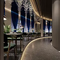 Elegant Modern Restaurant Interior With Blue Curtains Green Plants And Ambient Lighting