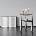 Modern Black Three Tier Side Table With Candles Bowl And Open Book