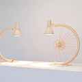 Two Industrial Style Floor Lamps With Curved Arm And Bicycle Wheel Design