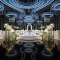 Luxurious Banquet Hall With Circular Crystal Chandeliers White Stage Floral Decor And Glossy Reflective Floor