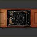 Vintage Camera With Orange Leather Case Black Lens And Folding Design