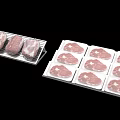 Fresh Raw Meat Pieces Packaged in White Trays for Display and Sale