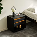 Black Nightstand With Drawers Geometric Lamp Small Plate And Candles By Bed With White Sheets