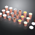 Red and White Striped Paper Cups Containing Popcorn and Snacks with Straws and Lids