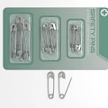 Stainless Steel Safety Pins in Green Packaging with Loose Pins Displayed