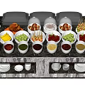 Buffet Table With Various Foods Dishes Warming Lids And Fruit Arrangement