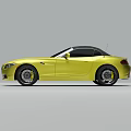 Yellow Convertible Sports Car With Black Top Sleek Front And Black Wheels