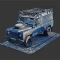 Vintage Blue Silver Off Road Vehicle With Roof Rack Front Spare Tire On Stone Pavement