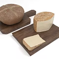 Round Cross Shaped Bread and Cheese Block with Slice on Wooden Cutting Boards