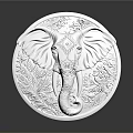 Silver Round Jewelry Piece With Elephant Carving Intricate Design And Shiny Surface On Dark Background