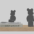Stylish Black Bear Decorative Ornament Set Placed On Books Over Wooden Table