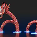Red Dragon Shaped Art Installation with Curved Body and Illuminated Base against Dark Background