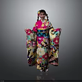 Woman Wearing Colorful Kimono With Floral Patterns Standing Against Gray Background