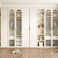 Modern Walk-in Closet Interior With White Cabinets Glass Doors Wooden Flooring And Potted Plant