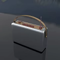 Portable Retro Style Radio with Silver Body Brown Handle and Antenna for Daily Use