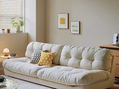 Beige Double Sofa with Geometric and Yellow Pillows Near Wall Art and Table Lamp 3d model