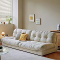 Beige Double Sofa with Geometric and Yellow Pillows Near Wall Art and Table Lamp