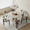 Round Dining Table Set With Six Upholstered Chairs Vase Candles And Spherical Pendant Light