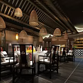 Traditional Chinese Restaurant Interior With Wicker Pendant Lights Wooden Ceiling And Dining Furniture