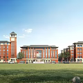 Traditional Red Brick School Building With Clock Tower Green Lawn And Large Windows