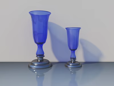 Two Blue Glass Vases With Silver Bases On Smooth Reflective Surface 3d model