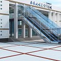 Modern Commercial Complex Exterior With Glass Escalator And Entrance Plaza