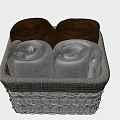 Four Brown and Gray Rolled Towels in Woven Basket Neatly Arranged