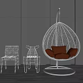 Stylish Rattan Hanging Chair With Brown Cushions And White Metal Chairs On Wooden Patio