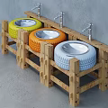 Textured Concrete Hand Basin with Wooden Stand and Two Taps Against Grey Wall