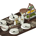 Complete Dinnerware Set With White Plates Bowls Cutlery And Fruit Stand On Wooden Table