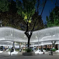 Modern Curved Pergola Design With Evening Lighting Surrounding Trees And Public Rest Area