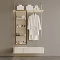 Modern Gold Frame Storage Shelf with Stacked Towels Bottles and Hanging Bathrobe and White Cabinet