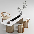 Modern Tea Table With White Marble Top Black Tea Tray Rattan Chairs And Green Plant