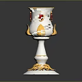 Elegant Decorative Cup With Silver Body Gold Accents Red Gemstones And Leaf Base