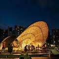 Illuminated Curved Wooden Pergola in Urban Night with People Gathering