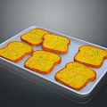 Golden Toast Slices With Yellow Spread And Green Herbs On White Tray